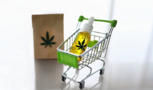 Shopping cart with CBD oil inside, symbolising how to buy CBD oil in Australia easily and conveniently